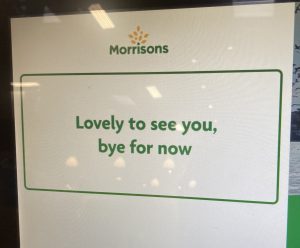 Photograph of the screen that appears at the end of checking out from a Morrisons self-service till that says lovely to see you, bye for now.